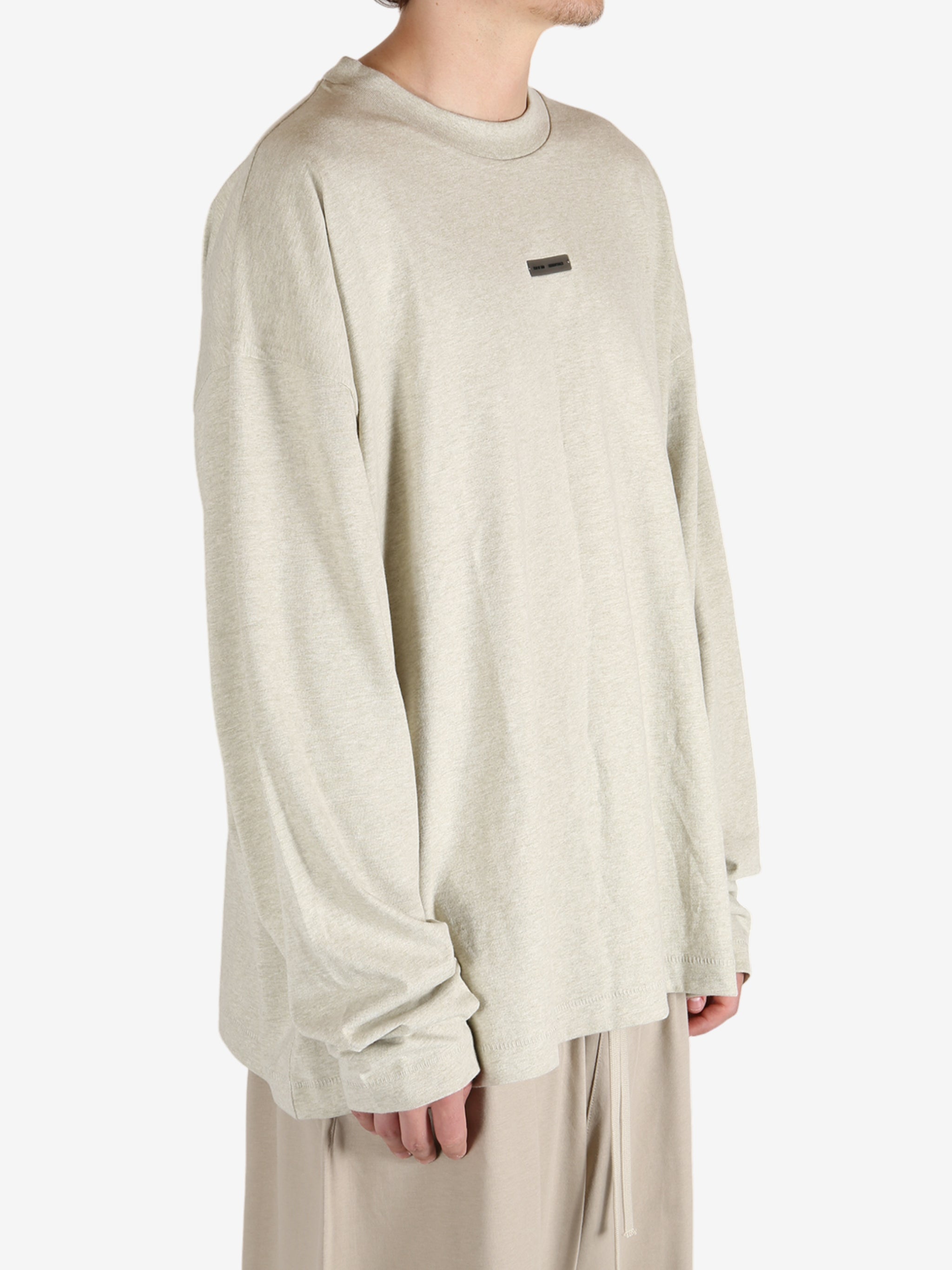 Tan tops worn by a person, showing the tops fit