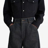 Close up of navy pants, showing texture of the denim fabric