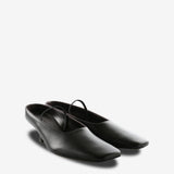 Black mules, side view