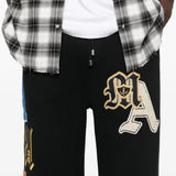 Close up of black pant, showing texture of the cotton fabric