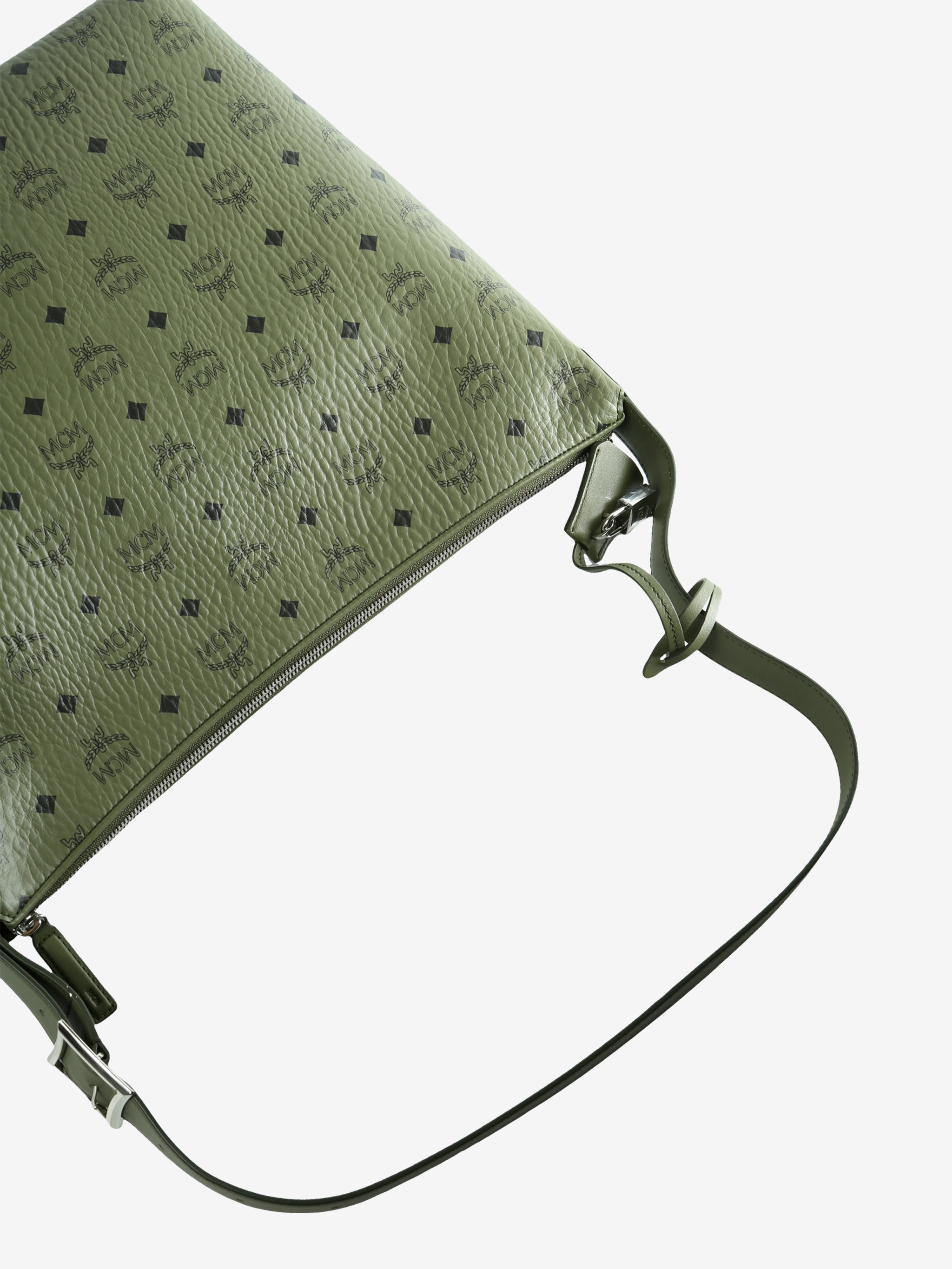 Close up of green bag, showing texture of the leather fabric
