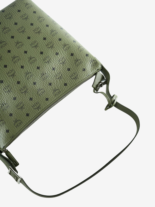 Close up of green bag, showing texture of the leather fabric
