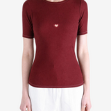 Burgundy t-shirt worn by a person, showing the t-shirt fit