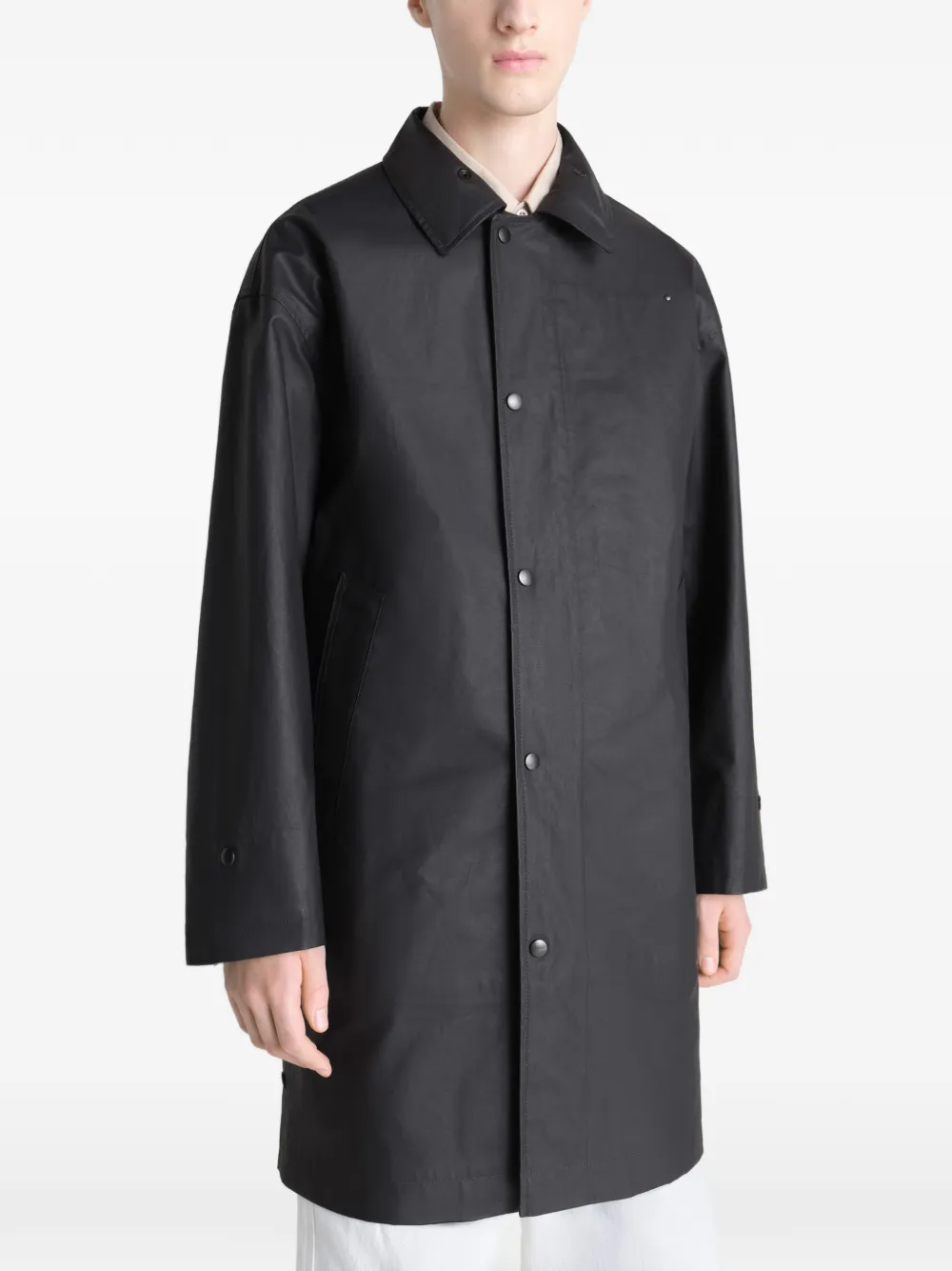 Black jacket worn by a person, showing the jacket's fit