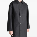 Black jacket worn by a person, showing the jacket's fit