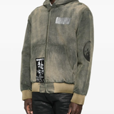 Green jacket worn by a person, showing the jacket fit