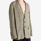 Green jacket worn by a person, showing the jacket fit