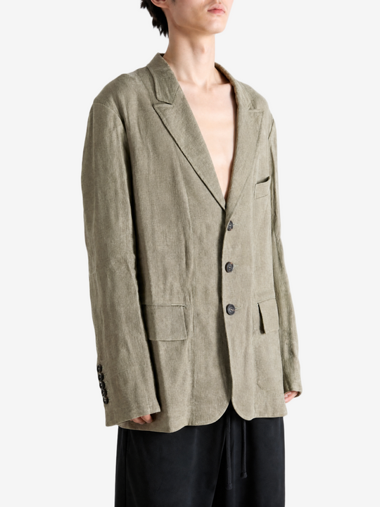 Green jacket worn by a person, showing the jacket fit