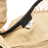 close up of brown bags, showing texture of the polyester fabric