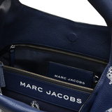 Close up of blue bags, showing texture of the polyester and cotton fabric