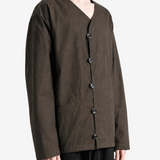 Brown knitwear worn by a person, showing the knitwear fit