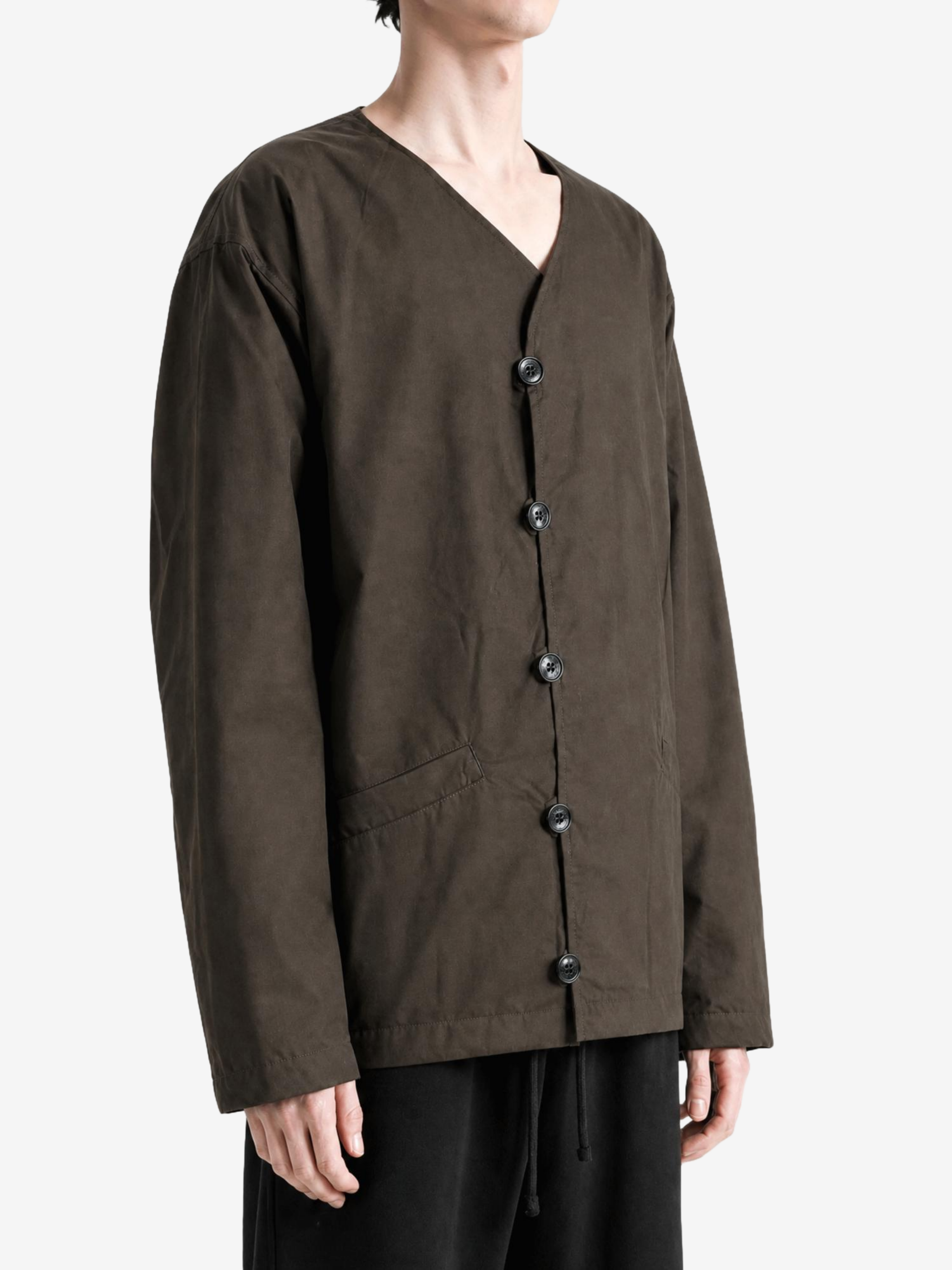 Brown knitwear worn by a person, showing the knitwear fit