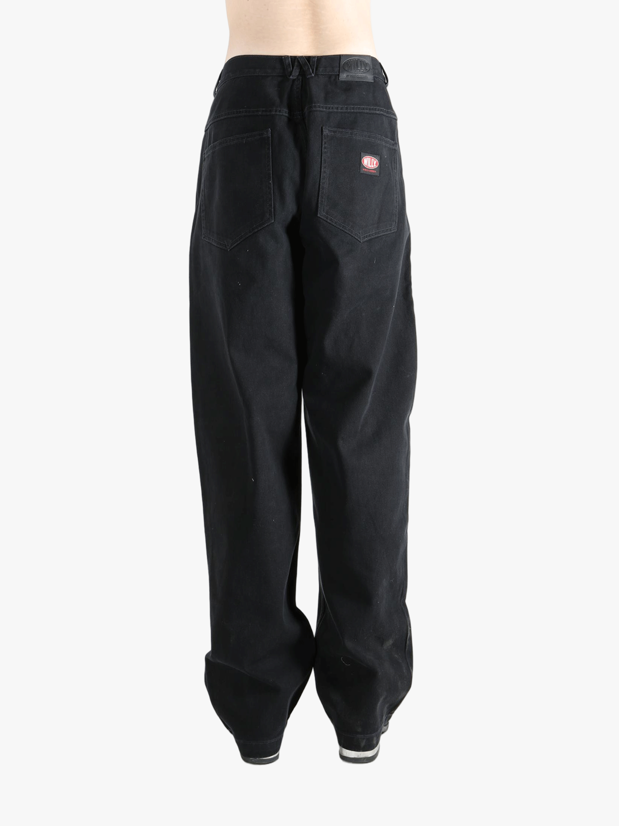 Black jean,worn by a person, showing the jeans fit