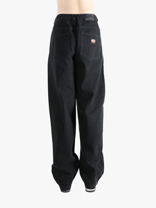 Black jean,worn by a person, showing the jeans fit