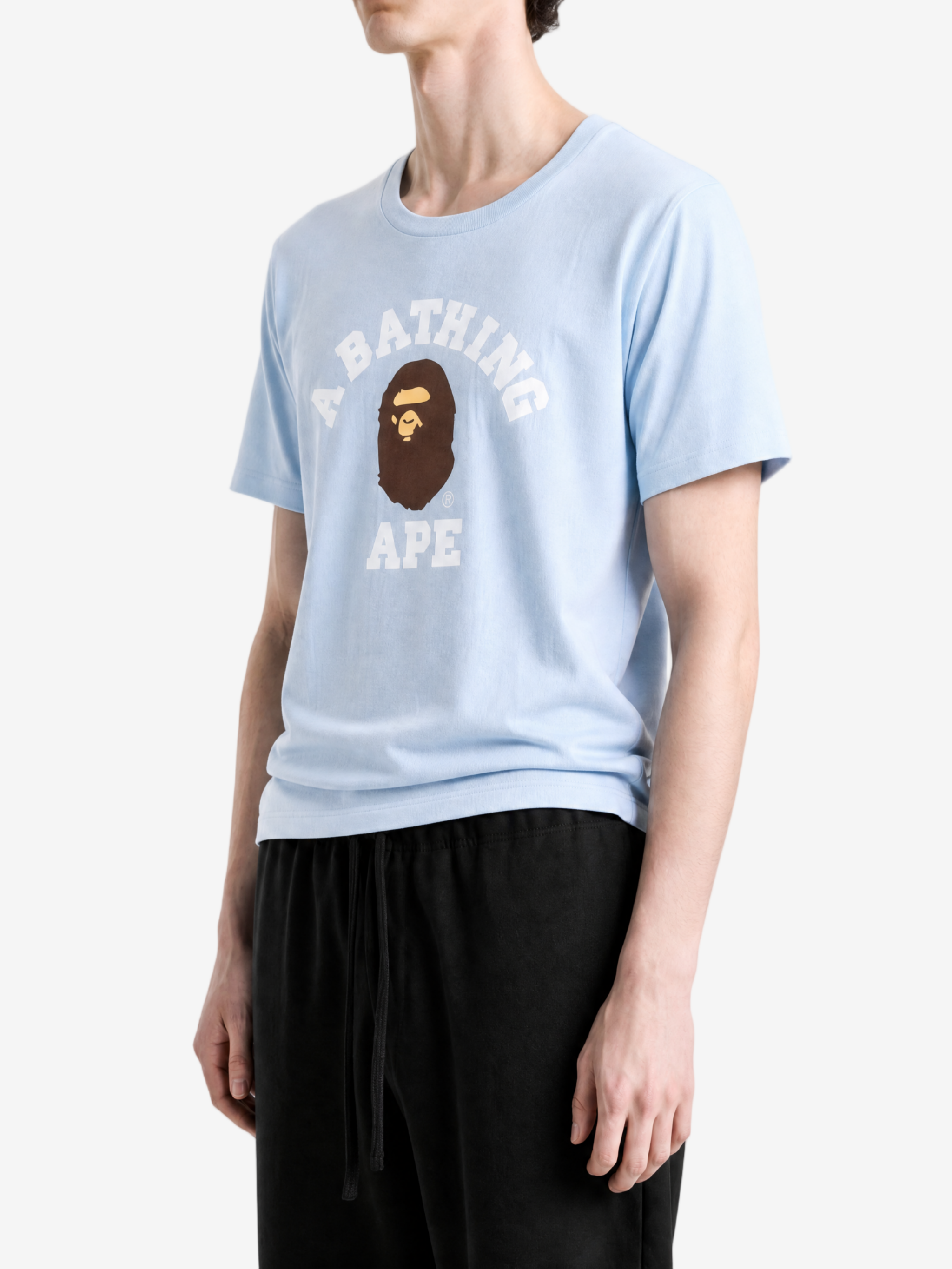 Blue t-shirt worn by a person, showing the t-shirt fit