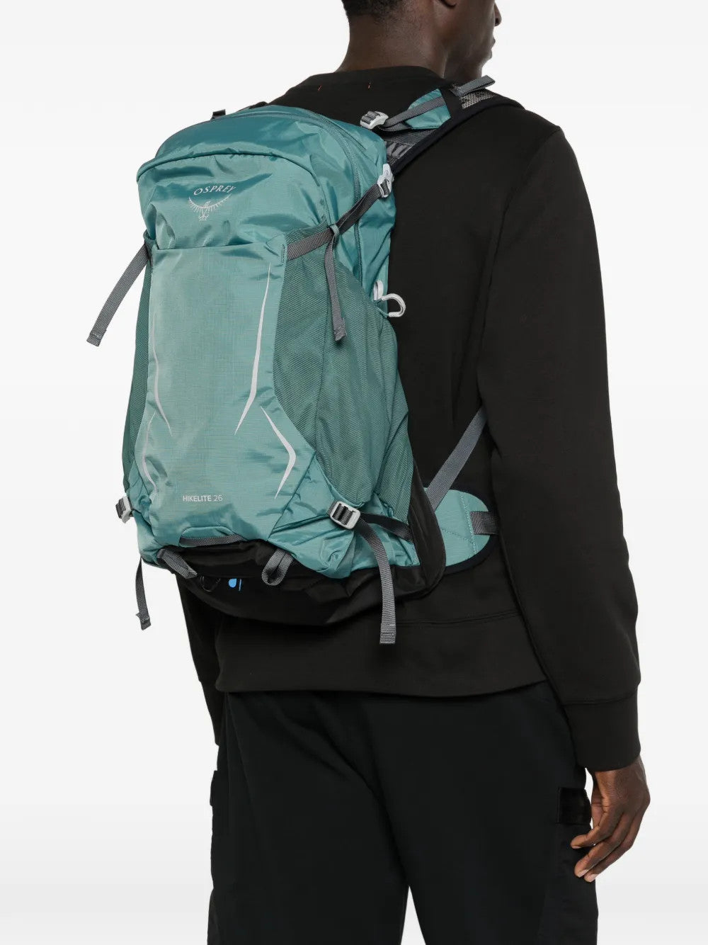 Green bag worn by a person, showing the bag fit