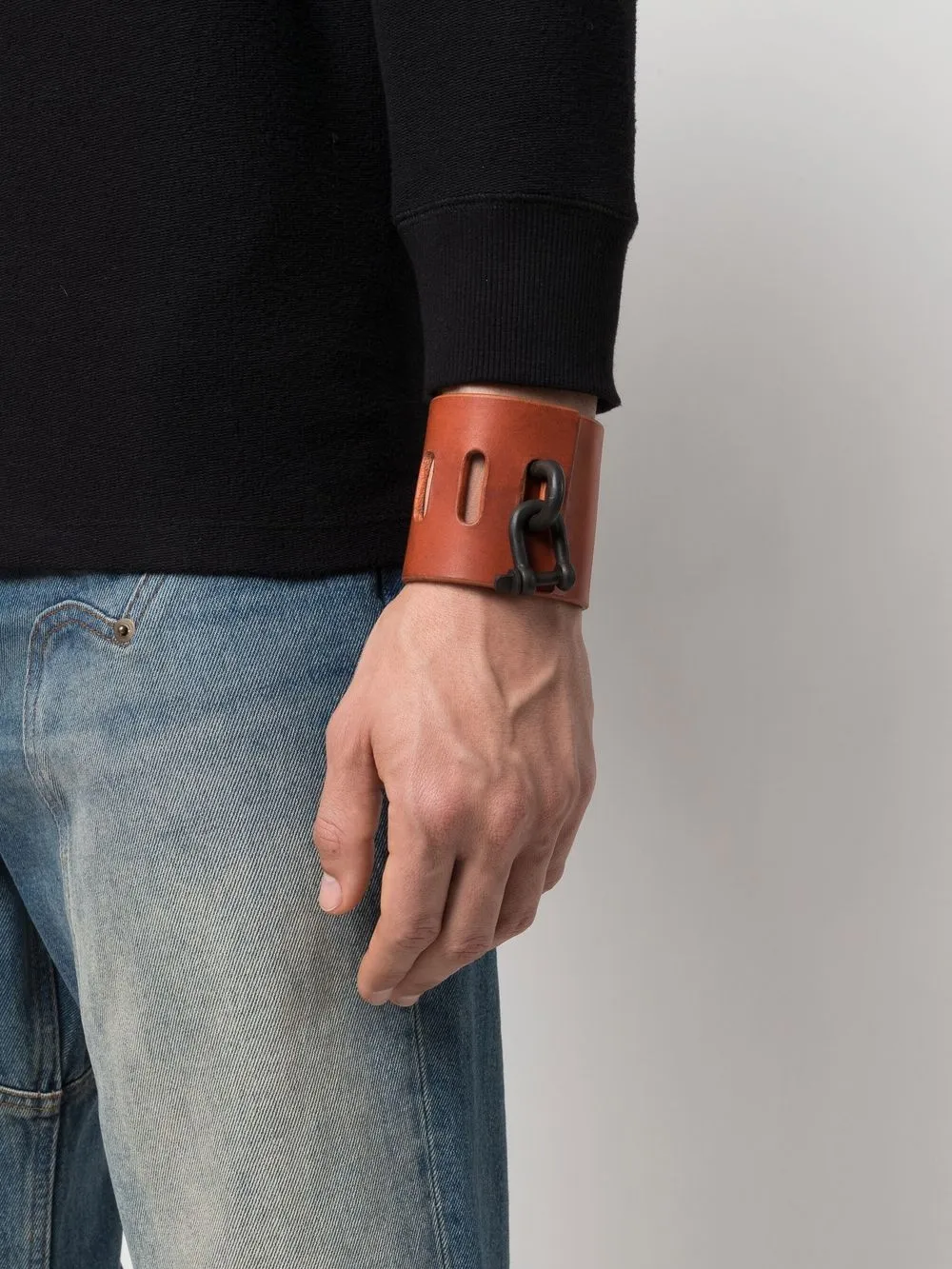 Red bracelet worn by a person, showing the bracelet fit