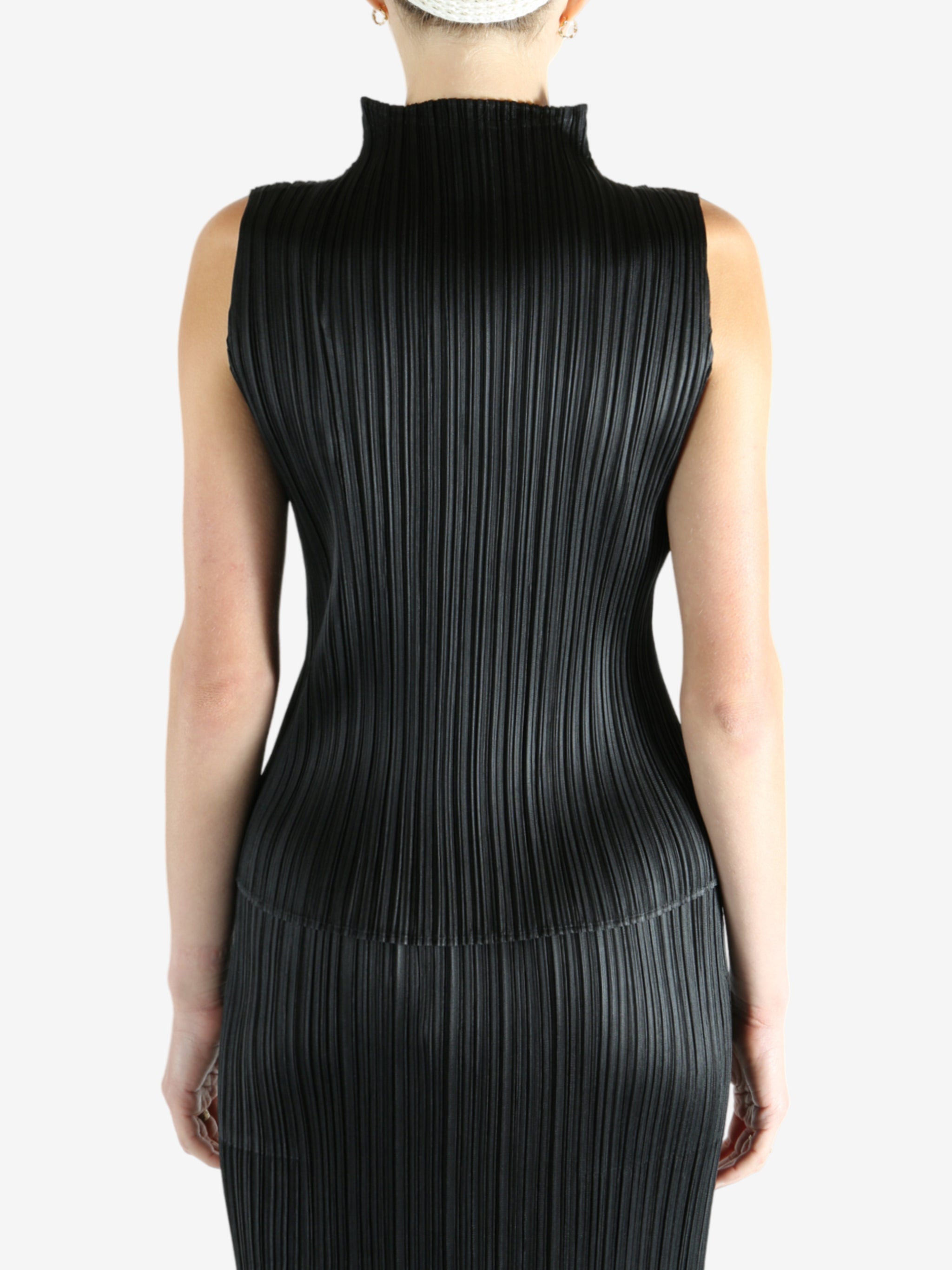 Black shirts worn by a person, showing the shirts fit