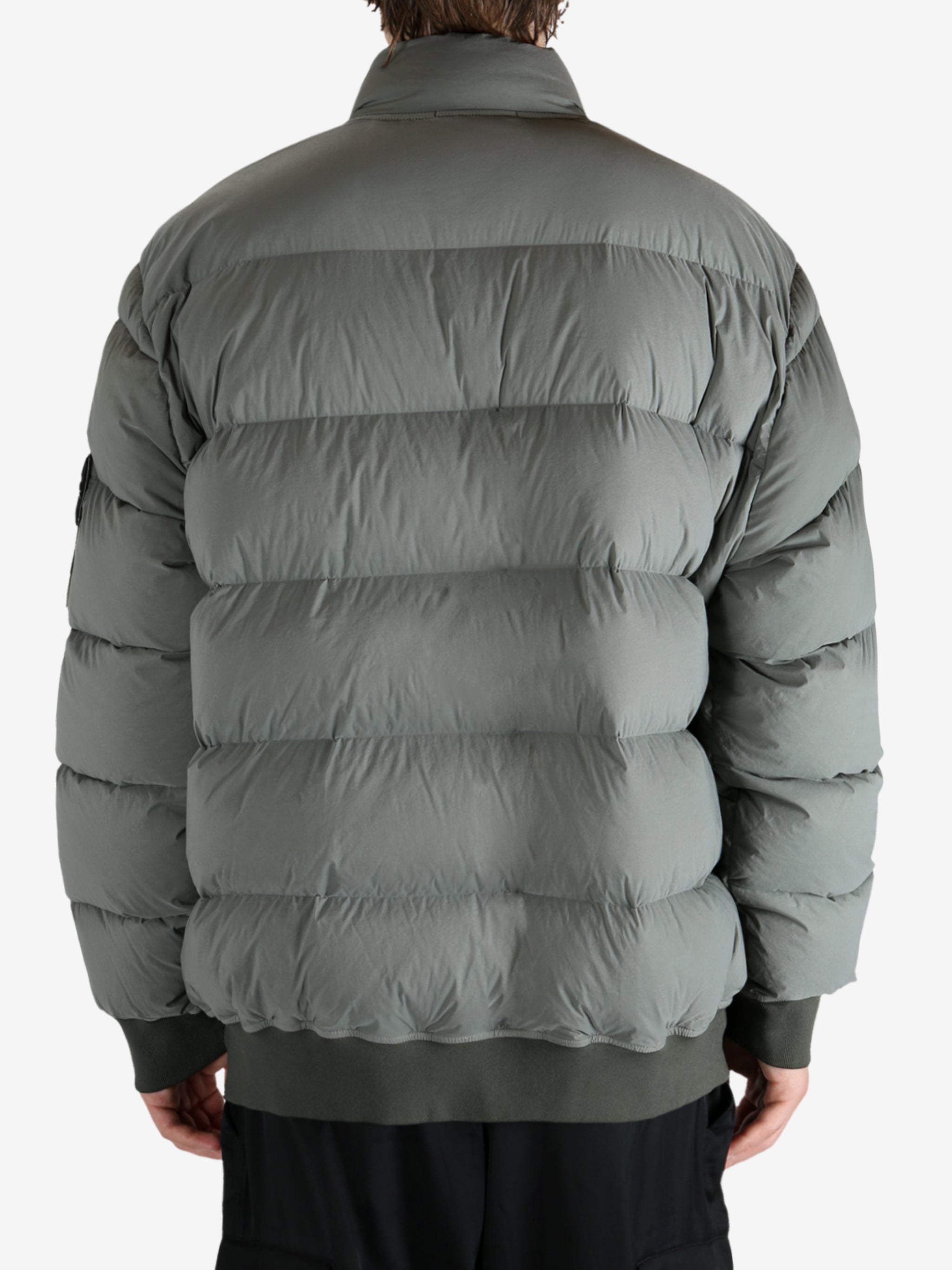 Grey jacket worn by a person, showing the jacket's fit