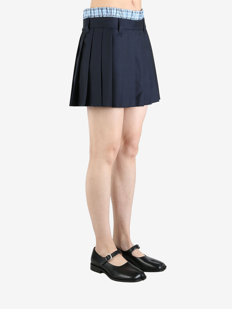 Blue skirt worn by a person, showing the skirt's fit