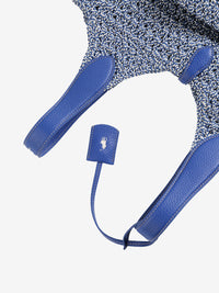 Close up of blue bag, showing texture of the leather fabric