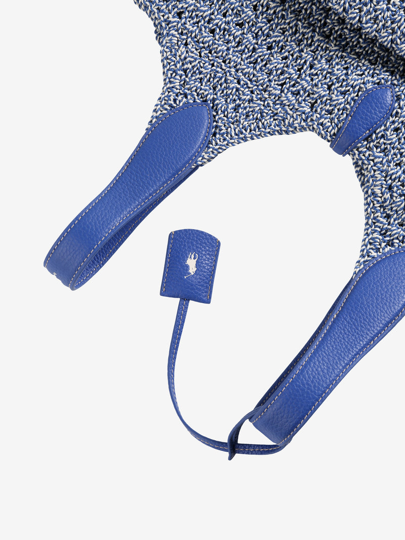 Close up of blue bag, showing texture of the leather fabric
