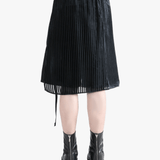 Black short worn by a person, showing the fit