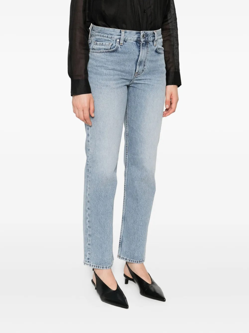 Blue jeans worn by a person, showing the jean's fit