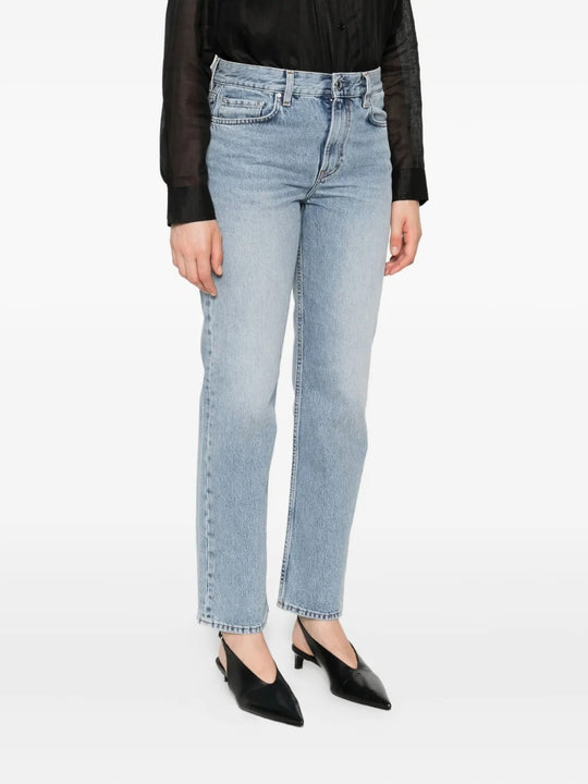 Blue jeans worn by a person, showing the jean's fit