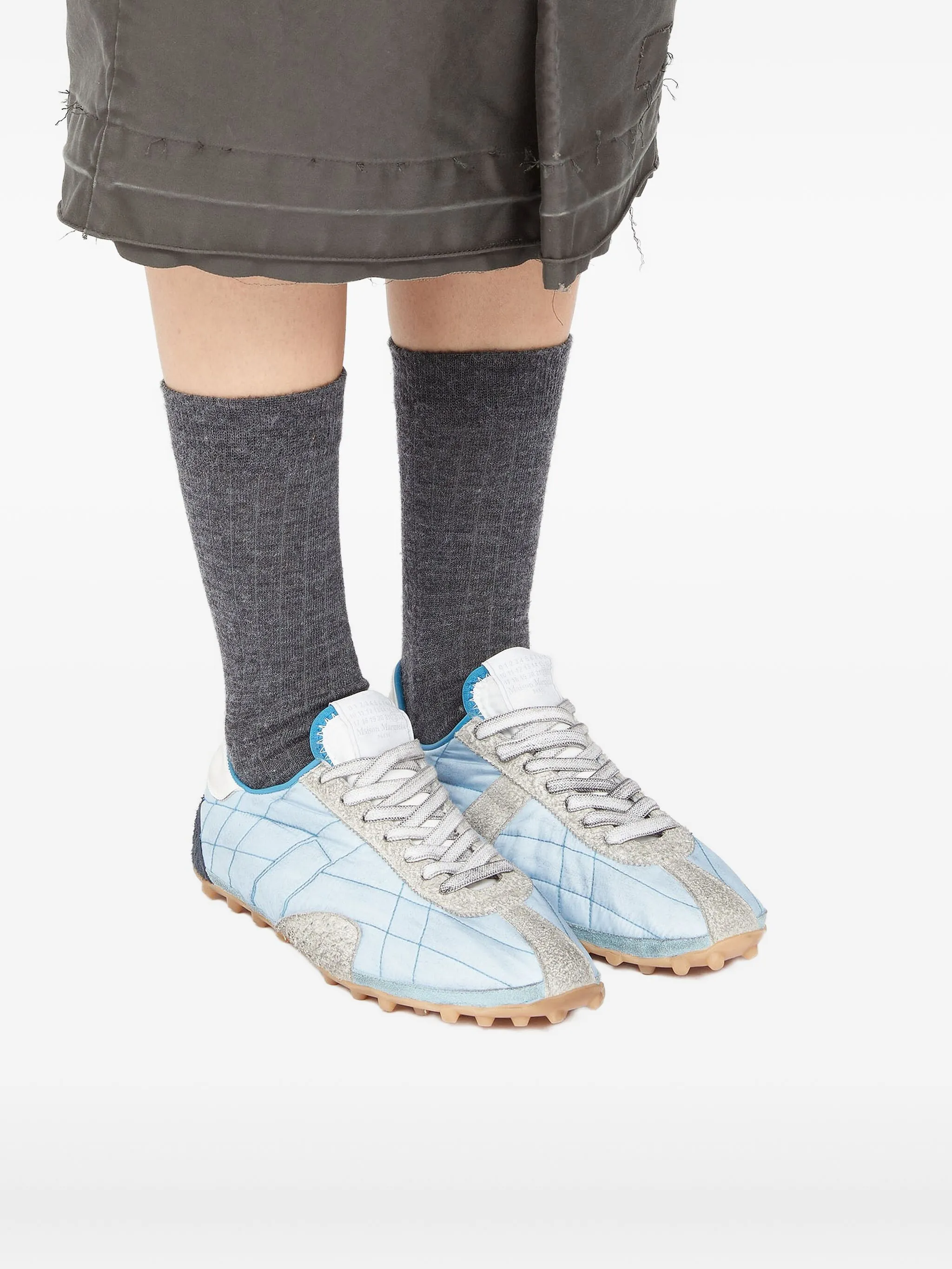 Blue shoes worn by a person, showing the shoes fit