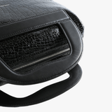 close up of black bags, showing texture of the leather fabric