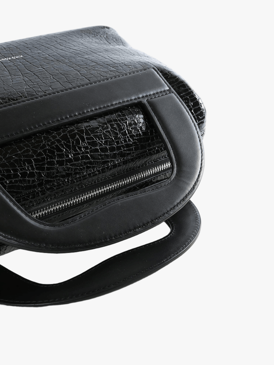 close up of black bags, showing texture of the leather fabric