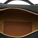 Close up of black bag, showing texture of the leather fabric