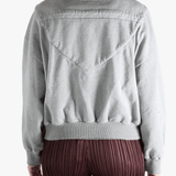 Grey jackets-coats worn by a person, showing the jackets-coats'fit