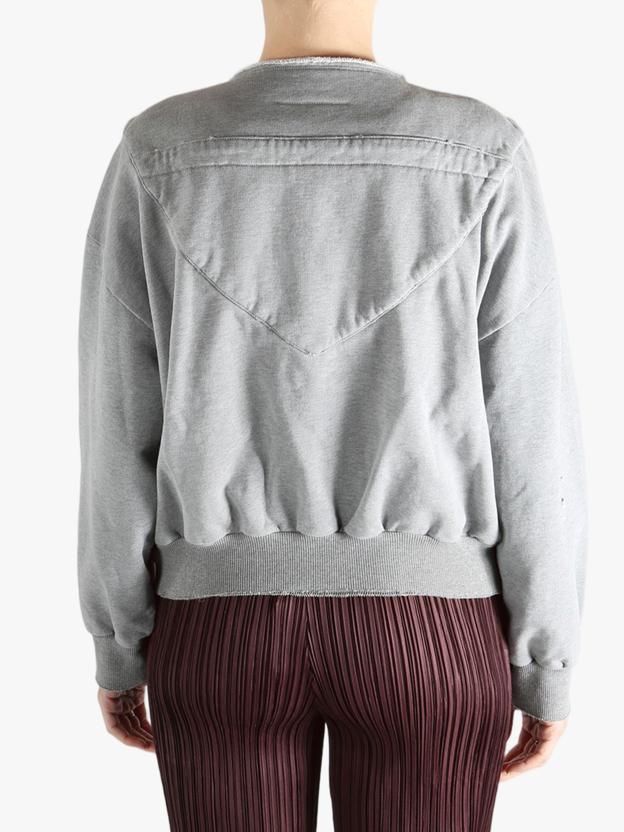 Grey jackets-coats worn by a person, showing the jackets-coats'fit