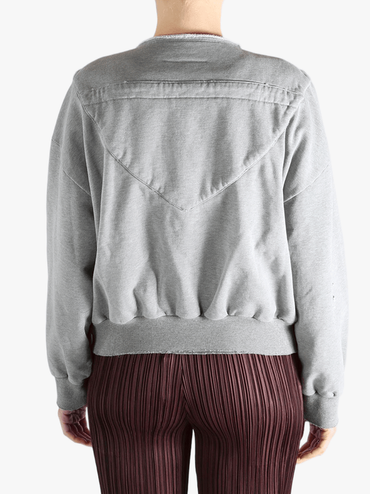 Grey jackets-coats worn by a person, showing the jackets-coats'fit