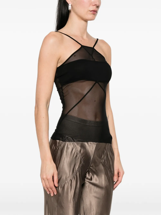 Black top worn by a person, showing the top fit