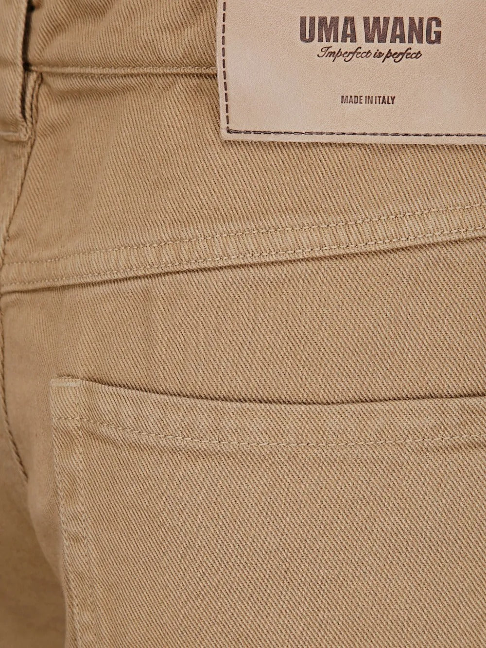 Brown pants worn by a person, showing the pants fit