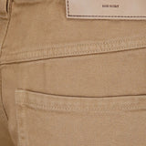 Brown pants worn by a person, showing the pants fit