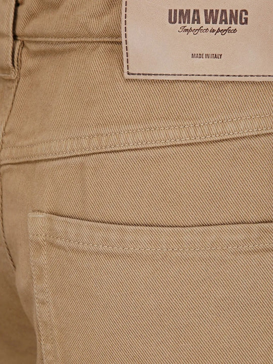 Brown pants worn by a person, showing the pants fit