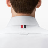 White shirt worn by a person, showing the shirt fit