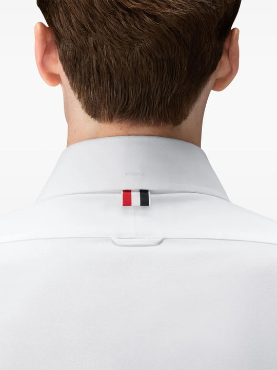 White shirt worn by a person, showing the shirt fit