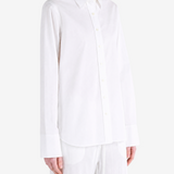 White shirt worn by a person, showing the shirt fit