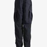 Black pants worn by a person, showing the pants fit
