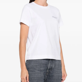White t-shirt worn by a person, showing the shirt's fit