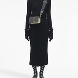 Grey bags worn by a person, showing the bags fit