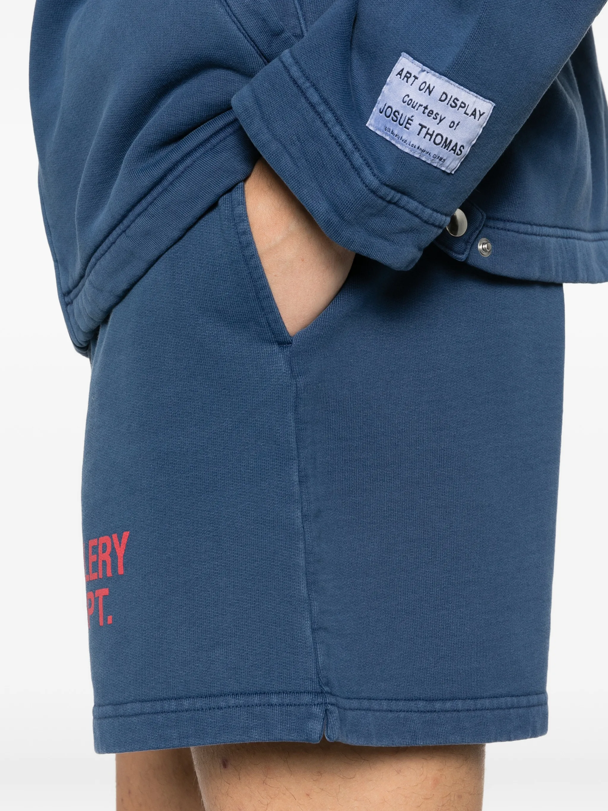 Close up of blue shorts, showing texture of the cotton fabric