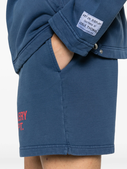 Close up of blue shorts, showing texture of the cotton fabric