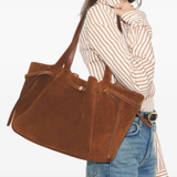 Brown bags worn by a person, showing the bags fit