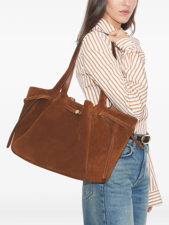 Brown bags worn by a person, showing the bags fit